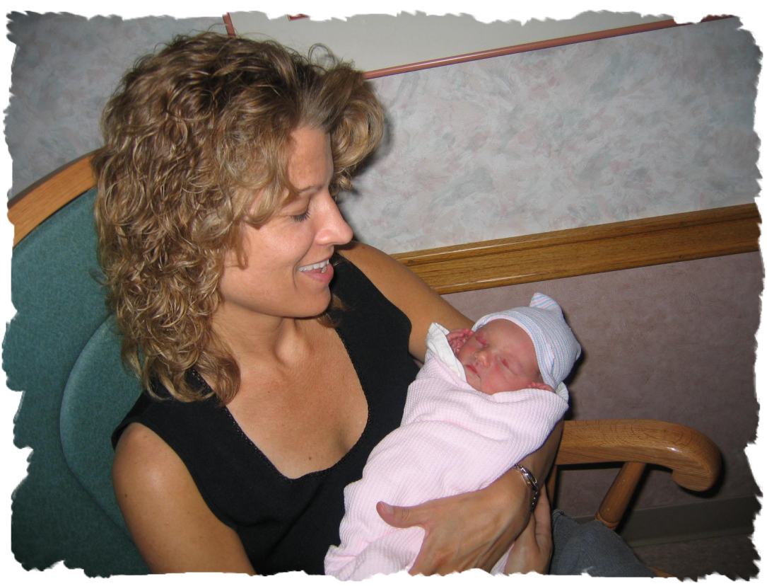 Me holding my granddaughter June 2006